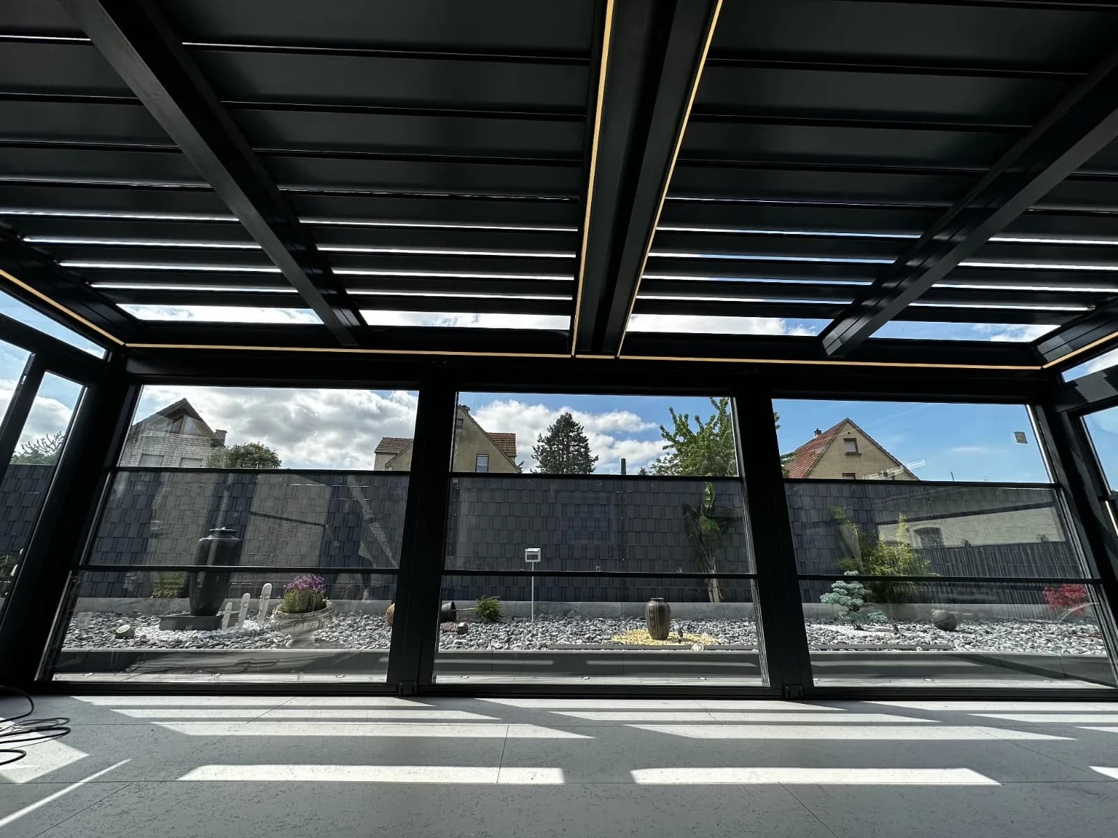 Pergola installed over stone terrace